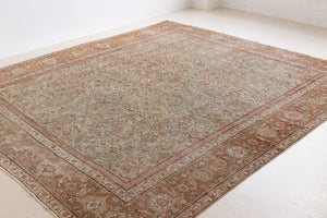 Mahal rugs are some of the most desirable Persian village rugs. This Carpet features an extremely rare pistachio green field and a highly unique floral Herati design 
