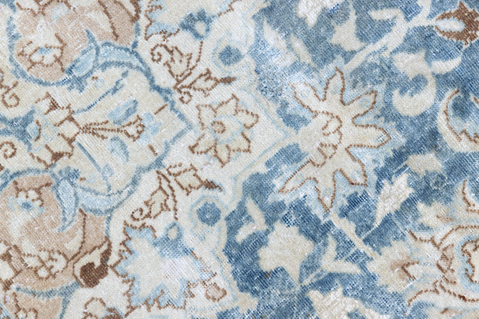This is a vintage Persian Keshan rug that has been over-dyed to gently fade its original colours, giving a more neutral palette. Persia has the most desirable rugs and carpets with stunning designs such as this carpet. Now available at Ourika London.