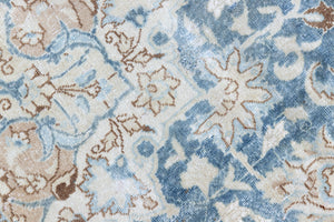 This is a vintage Persian Keshan rug that has been over-dyed to gently fade its original colours, giving a more neutral palette. Persia has the most desirable rugs and carpets with stunning designs such as this carpet. Now available at Ourika London.