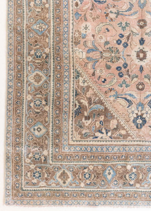 This is a handmade vintage Tabriz rug woven in Persia. The Tabriz region is known for producing some of the most ornate Persian carpet, often known for their mesmerising and intricate repeating patterns.