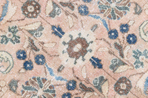 This is a handmade vintage Tabriz rug woven in Persia. The Tabriz region is known for producing some of the most ornate Persian carpet, often known for their mesmerising and intricate repeating patterns.