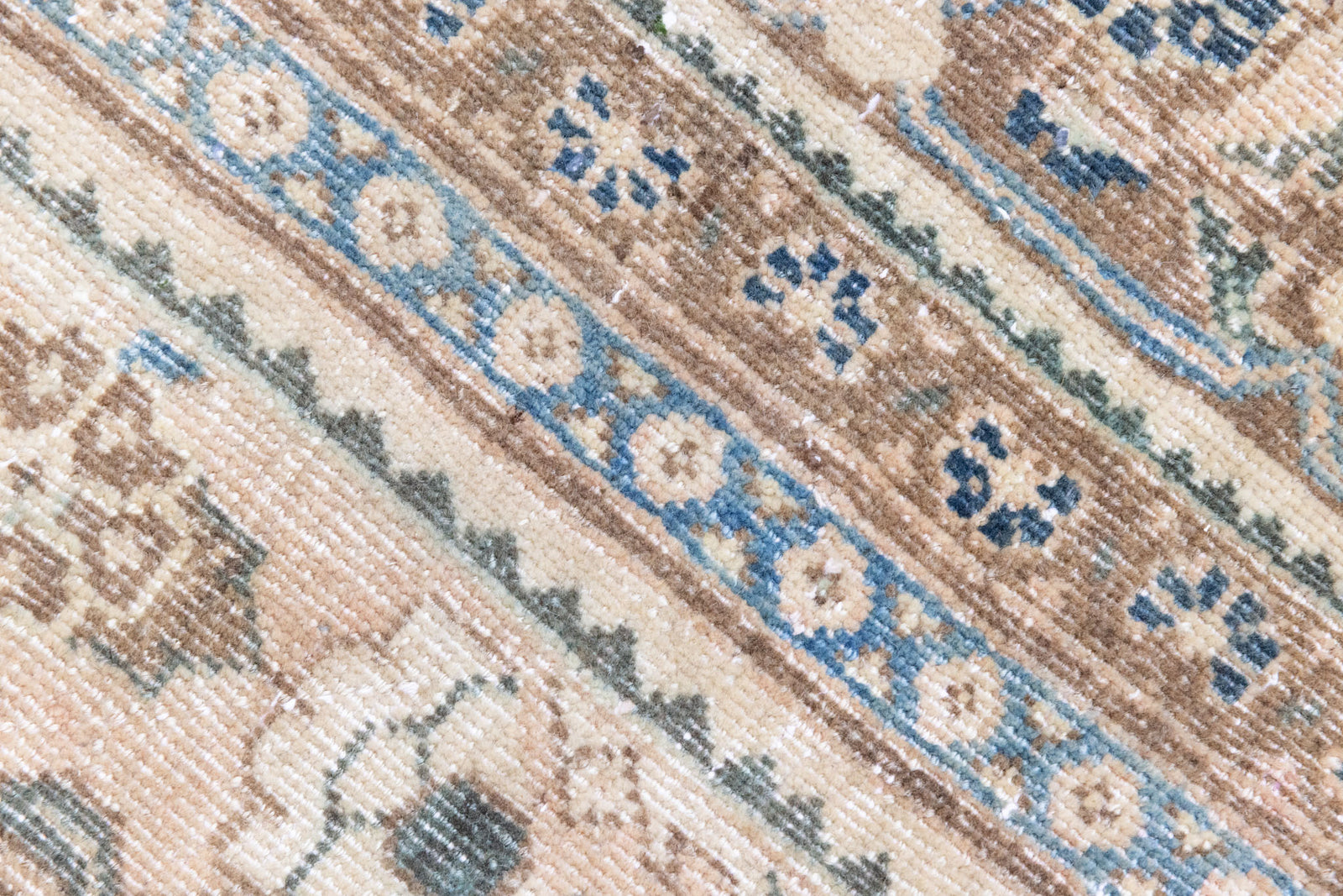 This is a handmade vintage Tabriz rug woven in Persia. The Tabriz region is known for producing some of the most ornate Persian carpet, often known for their mesmerising and intricate repeating patterns.