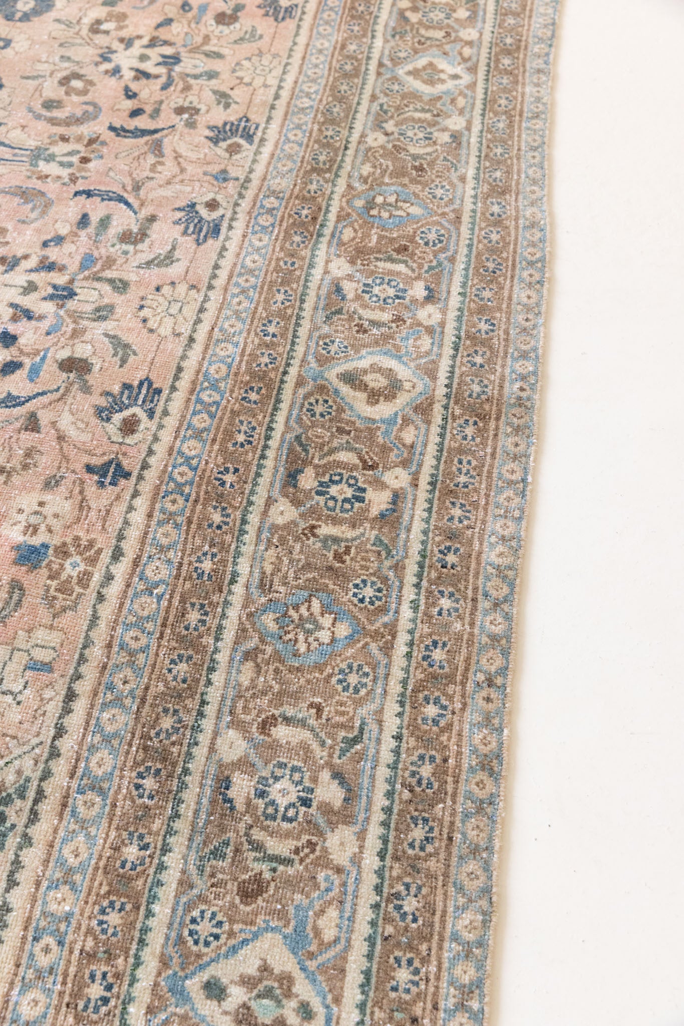 This is a handmade vintage Tabriz rug woven in Persia. The Tabriz region is known for producing some of the most ornate Persian carpet, often known for their mesmerising and intricate repeating patterns.
