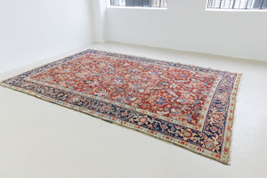 This is a handmade antique Heriz rug woven in Persia. The Heriz region is known for producing some of the most ornate Persian carpet, often known for their mesmerising and intricate repeating patterns.