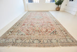 A huge, beautiful Mahal carpet, with an intricate floral motif in blue, red and greens. 