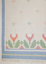 This is an original Swedish röllakan rug handwoven by the mid-century textile designer Anna Johanna Angström. Her colourful kilims often feature strong lines and designs inspired by floral and botanical motifs