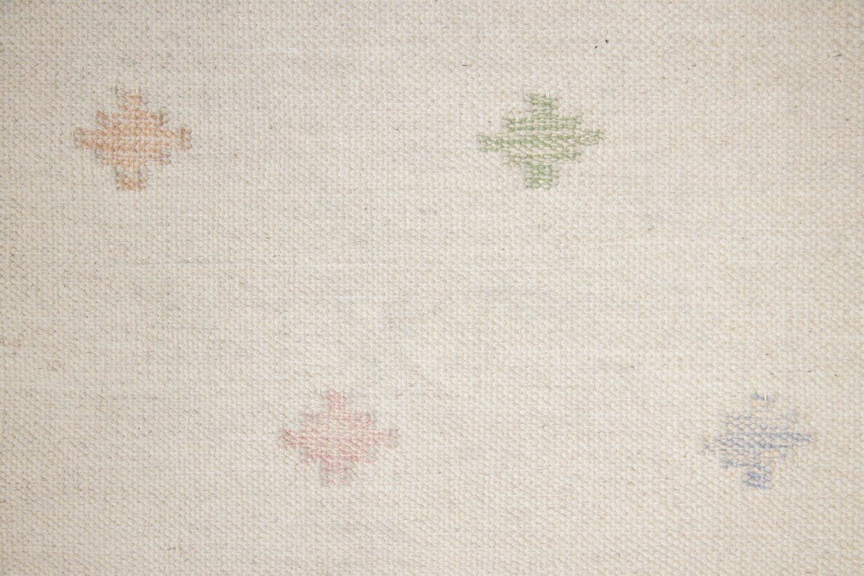 This is an original Swedish röllakan rug handwoven by the mid-century textile designer Anna Johanna Angström. Her colourful kilims often feature strong lines and designs inspired by floral and botanical motifs