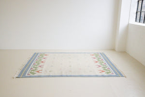 This is an original Swedish röllakan rug handwoven by the mid-century textile designer Anna Johanna Angström. Her colourful kilims often feature strong lines and designs inspired by floral and botanical motifs