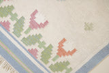This is an original Swedish röllakan rug handwoven by the mid-century textile designer Anna Johanna Angström. Her colourful kilims often feature strong lines and designs inspired by floral and botanical motifs