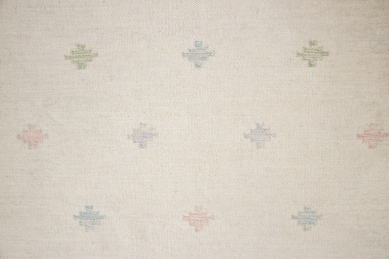 This is an original Swedish röllakan rug handwoven by the mid-century textile designer Anna Johanna Angström. Her colourful kilims often feature strong lines and designs inspired by floral and botanical motifs