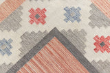 This is an original vintage röllakan rug signed by the renowned textile designer Karin Jonsson. This vintage rug features a beautiful and unique colour palette and a geometric design.