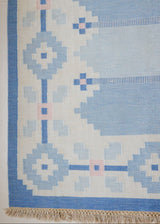 Dries is a vintage rug handwoven in Sweden for Svensk He Mslöjd which is a 1899 founded non-profit association that focused on Swedish textiles. This beautiful flatweave features a stunning blue colour palette and a geometric design