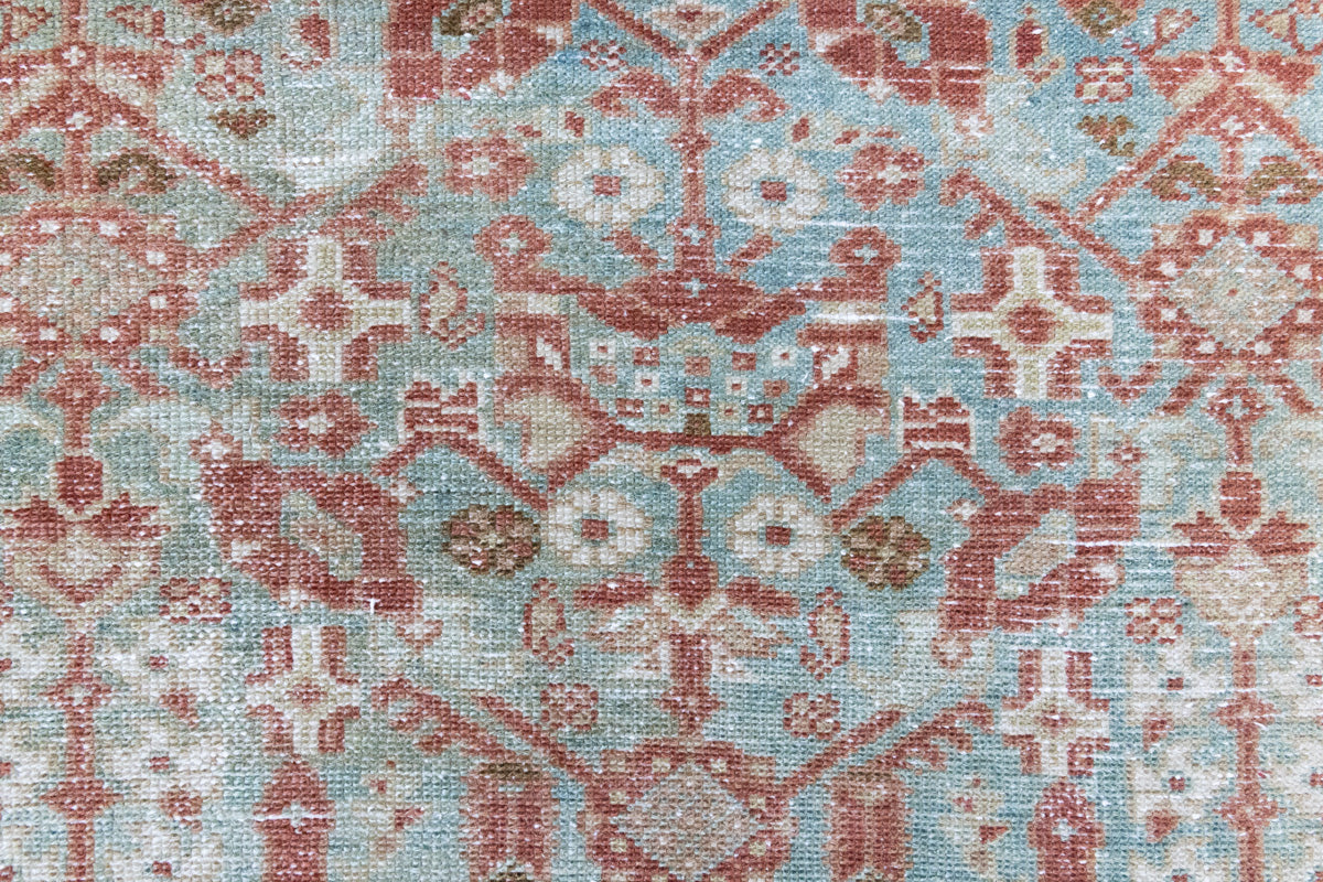 Sage is a Persian Malayer runner with a beautiful palette of blues and terracotta and a wonderful patina. The Malayer region is known for producing some of the most ornate Persian rugs, often known for their mesmerising and intricate repeating patterns.
