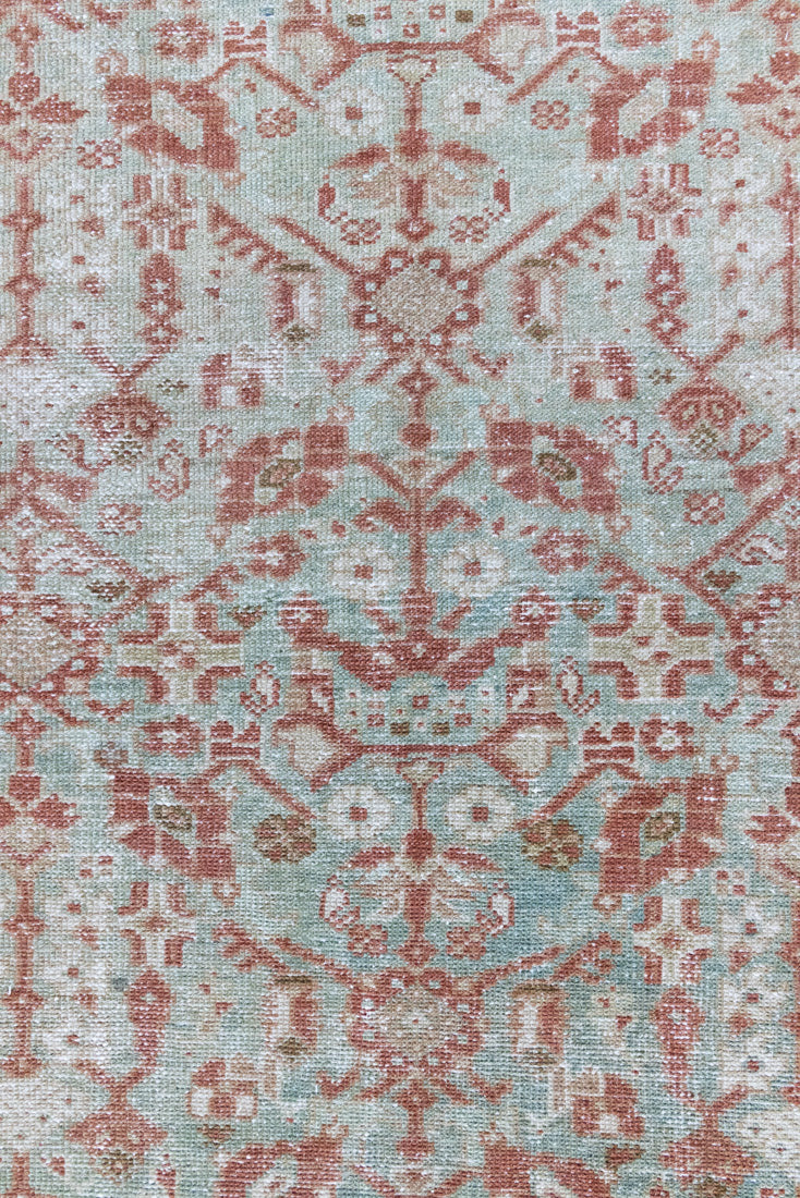 Sage is a Persian Malayer runner with a beautiful palette of blues and terracotta and a wonderful patina. The Malayer region is known for producing some of the most ornate Persian rugs, often known for their mesmerising and intricate repeating patterns.