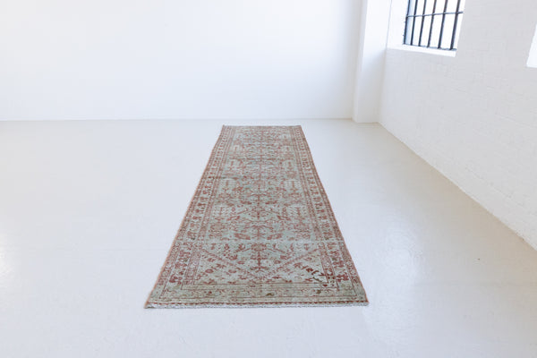 Sage is a Persian Malayer runner with a beautiful palette of blues and terracotta and a wonderful patina. The Malayer region is known for producing some of the most ornate Persian rugs, often known for their mesmerising and intricate repeating patterns.