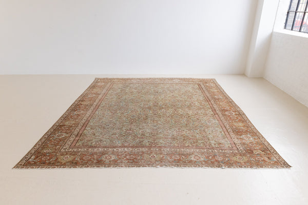Mahal rugs are some of the most desirable Persian village rugs. This Carpet features an extremely rare pistachio green field and a highly unique floral Herati design 