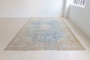 This is a vintage Persian Keshan rug that has been over-dyed to gently fade its original colours, giving a more neutral palette. Persia has the most desirable rugs and carpets with stunning designs such as this carpet. Now available at Ourika London.