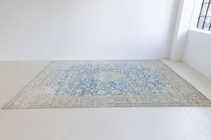 This is a vintage Persian Keshan rug that has been over-dyed to gently fade its original colours, giving a more neutral palette. Persia has the most desirable rugs and carpets with stunning designs such as this carpet. Now available at Ourika London.