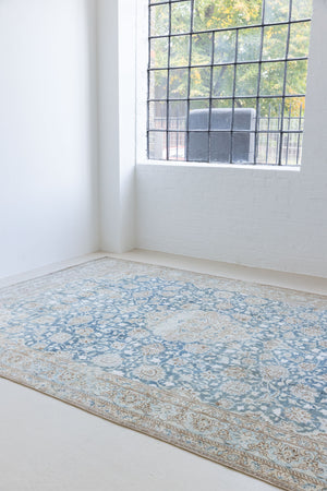 This is a vintage Persian Keshan rug that has been over-dyed to gently fade its original colours, giving a more neutral palette. Persia has the most desirable rugs and carpets with stunning designs such as this carpet. Now available at Ourika London.