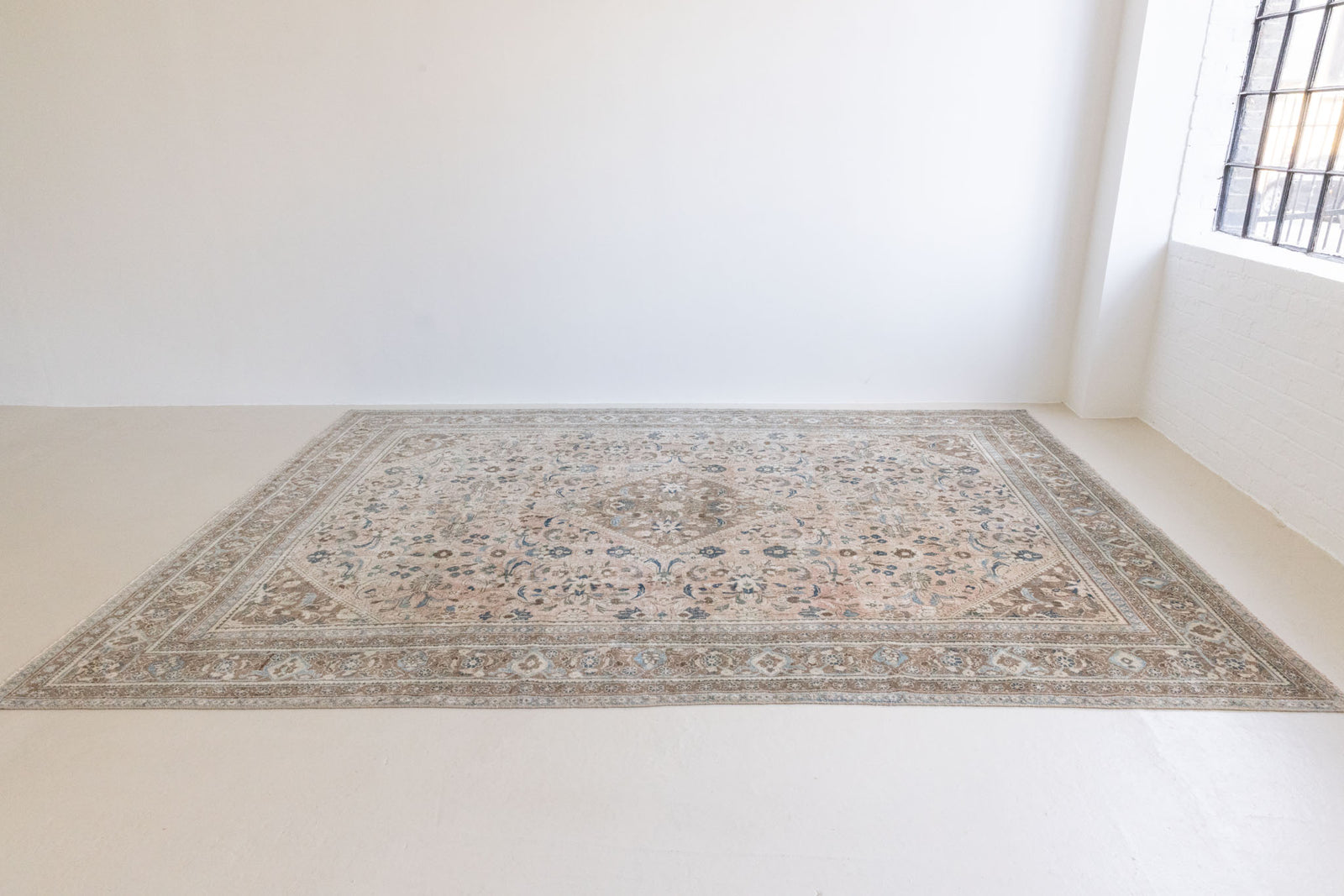 This is a handmade vintage Tabriz rug woven in Persia. The Tabriz region is known for producing some of the most ornate Persian carpet, often known for their mesmerising and intricate repeating patterns.