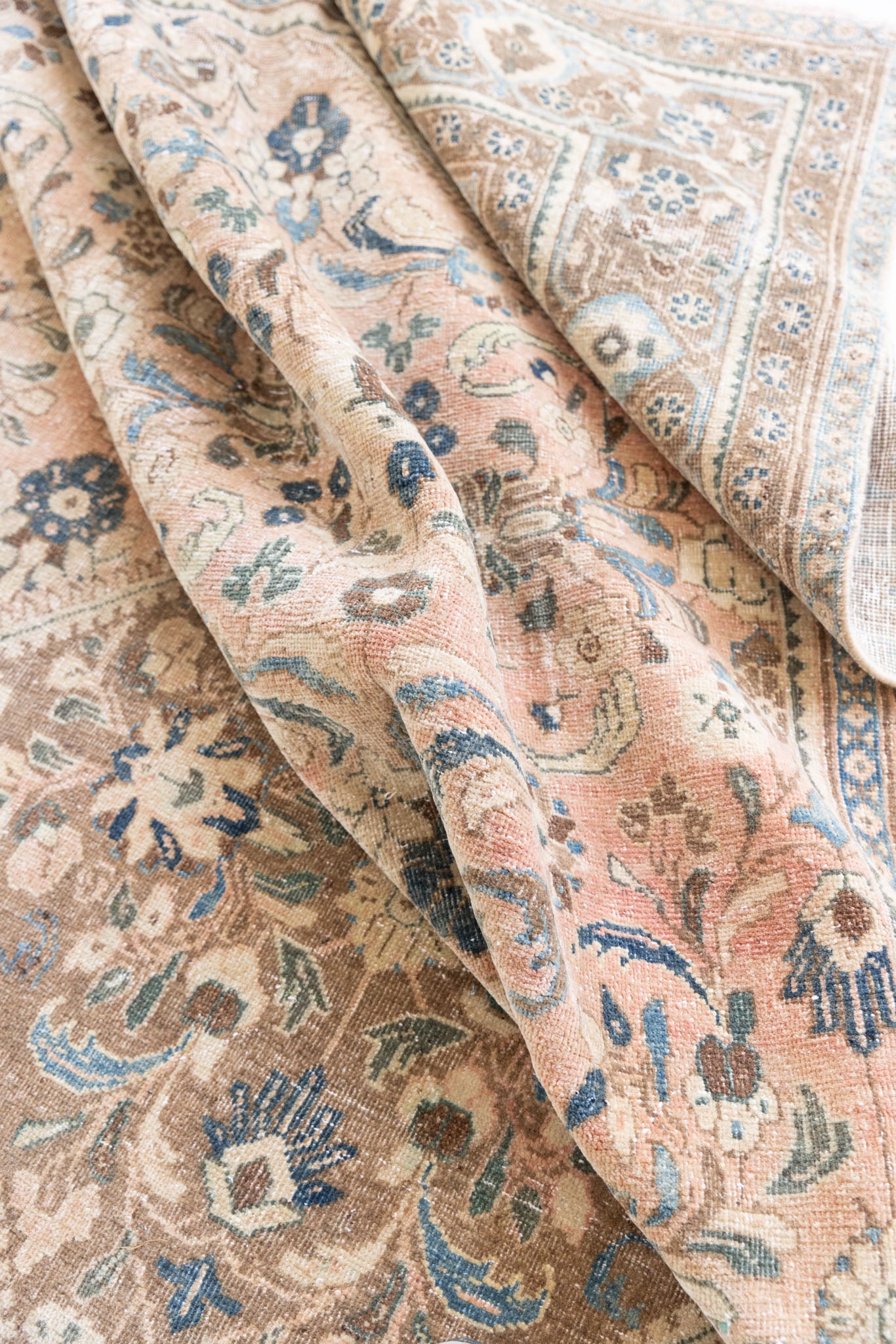 This is a handmade vintage Tabriz rug woven in Persia. The Tabriz region is known for producing some of the most ornate Persian carpet, often known for their mesmerising and intricate repeating patterns.