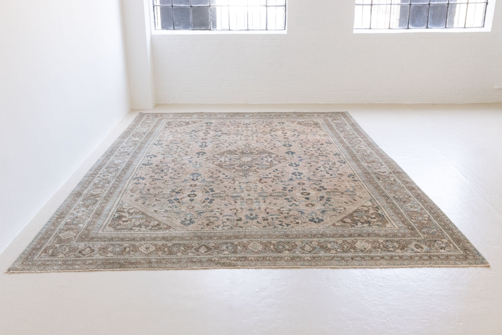 This is a handmade vintage Tabriz rug woven in Persia. The Tabriz region is known for producing some of the most ornate Persian carpet, often known for their mesmerising and intricate repeating patterns.