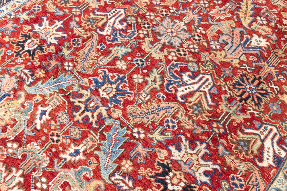 This is a handmade antique Heriz rug woven in Persia. The Heriz region is known for producing some of the most ornate Persian carpet, often known for their mesmerising and intricate repeating patterns.