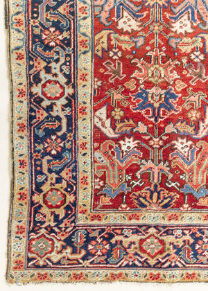 This is a handmade antique Heriz rug woven in Persia. The Heriz region is known for producing some of the most ornate Persian carpet, often known for their mesmerising and intricate repeating patterns.