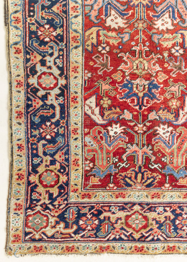 This is a handmade antique Heriz rug woven in Persia. The Heriz region is known for producing some of the most ornate Persian carpet, often known for their mesmerising and intricate repeating patterns.