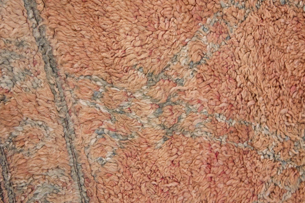 Aliya Beni M’guild vintage thick pile carpet. Peach coloured with a grey geometric pattern.
