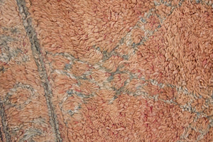 Aliya Beni M’guild vintage thick pile carpet. Peach coloured with a grey geometric pattern.