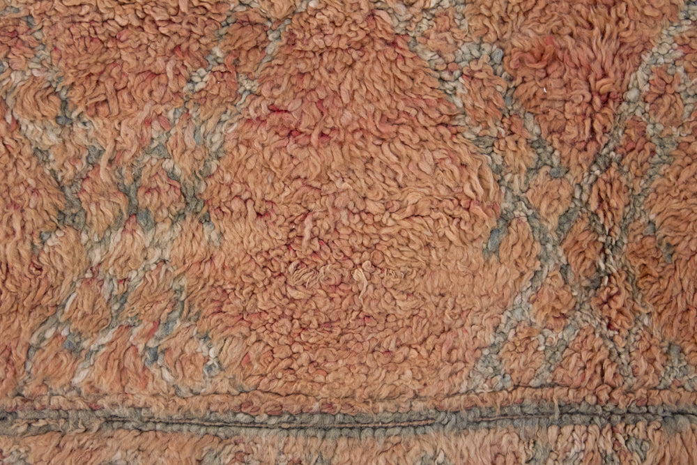 Aliya Beni M’guild vintage thick pile carpet. Peach coloured with a grey geometric pattern.