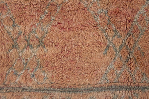 Aliya Beni M’guild vintage thick pile carpet. Peach coloured with a grey geometric pattern.
