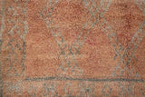 Aliya Beni M’guild vintage thick pile carpet. Peach coloured with a grey geometric pattern.
