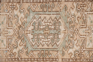 Bonnie is an vintage Persian Heriz runner rug which has been antique washed using a special technique to gently fade its original colours, creating a stunning muted palette. Heriz rugs are some of the most sought after Persian carpets and this one features a classic Heriz design in gorgeous soft blue, taupe and cream tones. 
