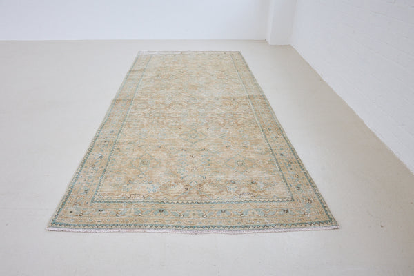 This hand knotted Persian long rug comes from the Tabriz region, one of the oldest rug weaving centres in the world. This beautiful piece features a calming colour palette and a stunning all over design.