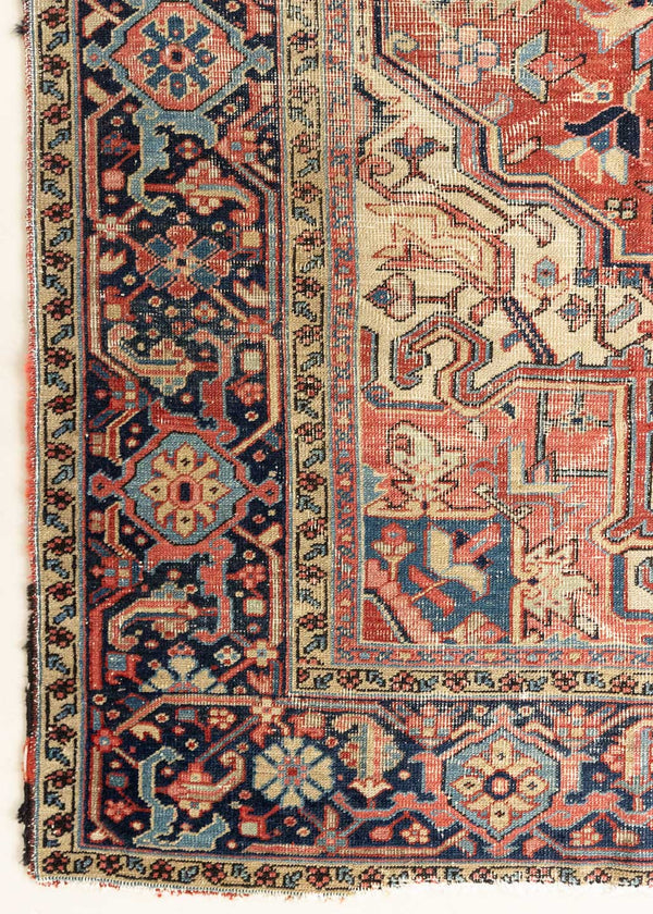 This is a handmade antique Heriz rug woven in Persia. The Heriz region is known for producing some of the most ornate Persian carpet, often known for their mesmerising and intricate repeating patterns.