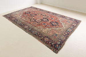 This is a handmade antique Heriz rug woven in Persia. The Heriz region is known for producing some of the most ornate Persian carpet, often known for their mesmerising and intricate repeating patterns.