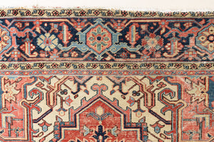 This is a handmade antique Heriz rug woven in Persia. The Heriz region is known for producing some of the most ornate Persian carpet, often known for their mesmerising and intricate repeating patterns.