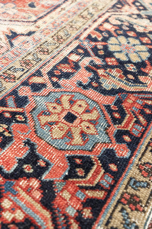 This is a handmade antique Heriz rug woven in Persia. The Heriz region is known for producing some of the most ornate Persian carpet, often known for their mesmerising and intricate repeating patterns.