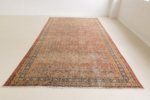 This is a handmade antique Mahal rug woven in Persia. The Mahal region is known for producing some of the most ornate Persian carpet, often known for their mesmerising and intricate repeating patterns.
