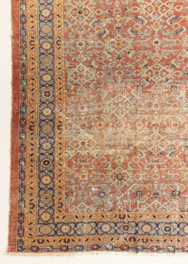 This is a handmade antique Mahal rug woven in Persia. The Mahal region is known for producing some of the most ornate Persian carpet, often known for their mesmerising and intricate repeating patterns.