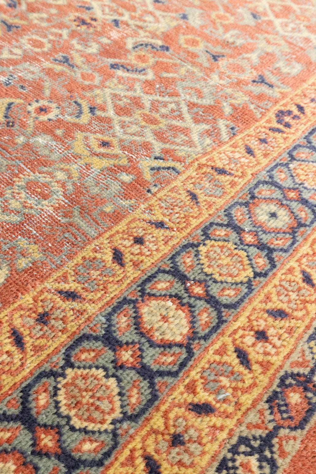 This is a handmade antique Mahal rug woven in Persia. The Mahal region is known for producing some of the most ornate Persian carpet, often known for their mesmerising and intricate repeating patterns.