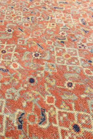 This is a handmade antique Mahal rug woven in Persia. The Mahal region is known for producing some of the most ornate Persian carpet, often known for their mesmerising and intricate repeating patterns.