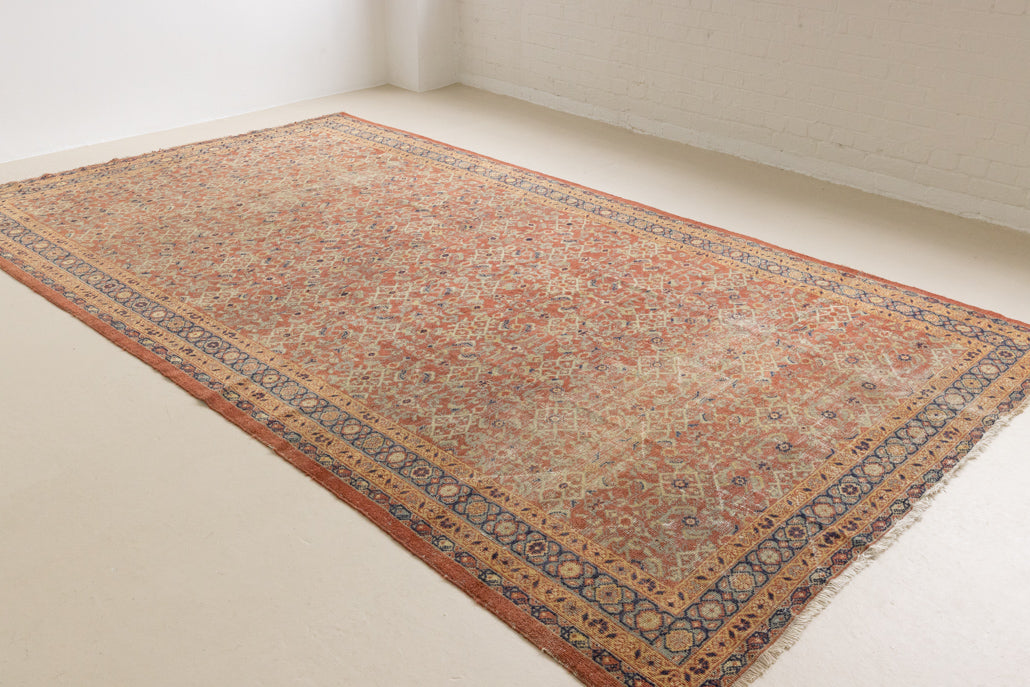 This is a handmade antique Mahal rug woven in Persia. The Mahal region is known for producing some of the most ornate Persian carpet, often known for their mesmerising and intricate repeating patterns.