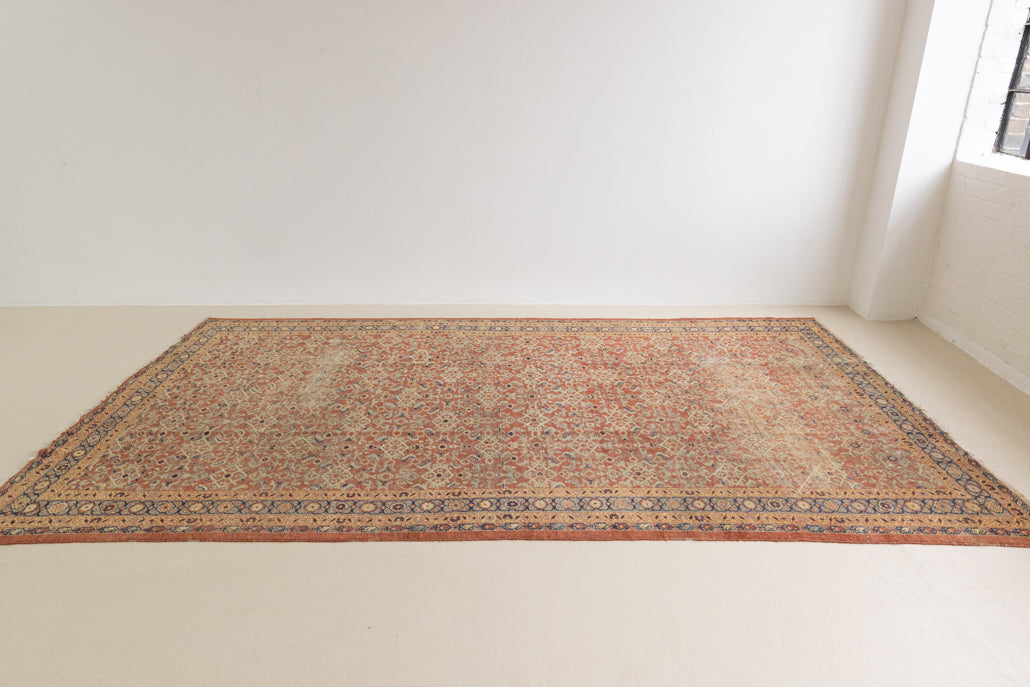 This is a handmade antique Mahal rug woven in Persia. The Mahal region is known for producing some of the most ornate Persian carpet, often known for their mesmerising and intricate repeating patterns.