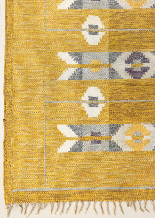 Eliza is a röllakan rug handwoven by textile designer Ingegerd Silow. Featuring a yellow, white and grey pattern