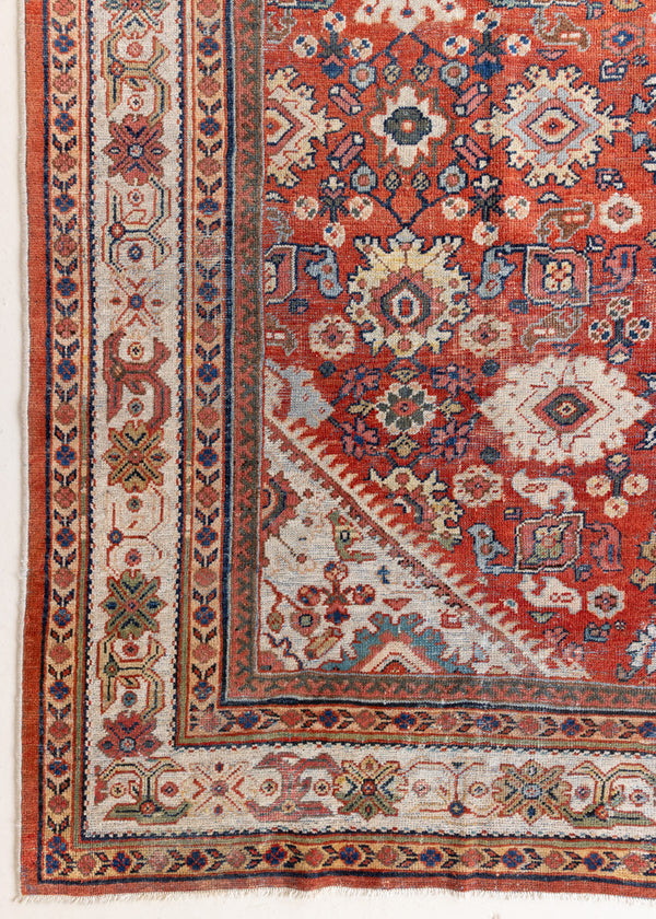 This a Vintage Persian Rug from Mahal in Persia. This hand woven Carpet features a lovely red ground with an all over design.