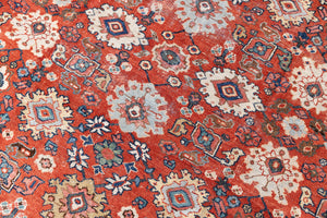 This a Vintage Persian Rug from Mahal in Persia. This hand woven Carpet features a lovely red ground with an all over design.