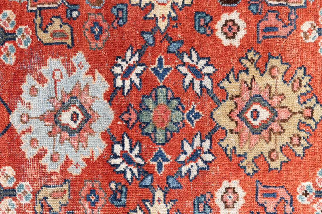 This a Vintage Persian Rug from Mahal in Persia. This hand woven Carpet features a lovely red ground with an all over design.